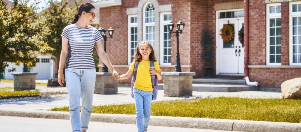 Parent and pupil go to school